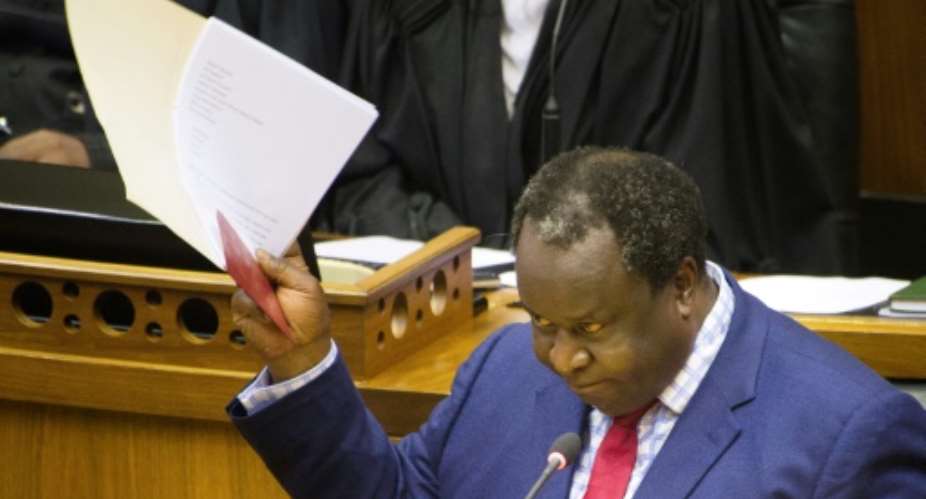 South Africa's Finance Minister Tito Mboweni delivers his maiden budget, unveiling a bailout for the state power utility after rolling blackouts.  By RODGER BOSCH AFP