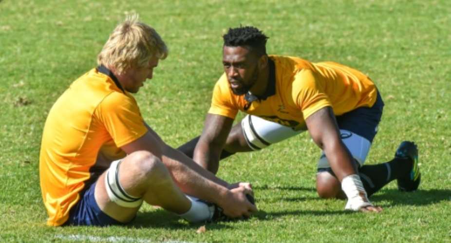 South Africa's first black Test rugby captain, Siya Kolisi, trains with teammate, flanker Pieter-Steph du Toit, at St Stithies College in Johannesburg, on May 28, 2018.  By Christiaan Kotze AFPFile
