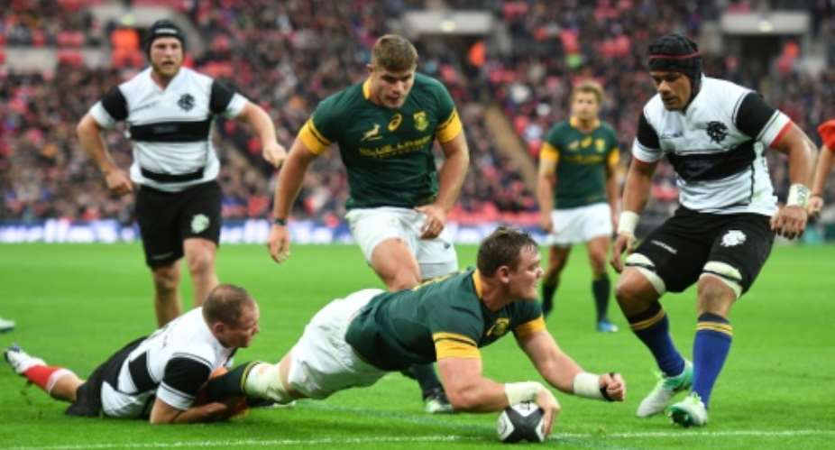 South Africa's flanker Roelof Smit scores a try during the international Test match against Barbarians on November 5, 2016.  By Justin Tallis AFPFile