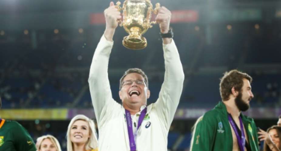 South Africa's head coach Rassie Erasmus lifts the Webb Ellis Cup.  By Odd ANDERSEN AFP