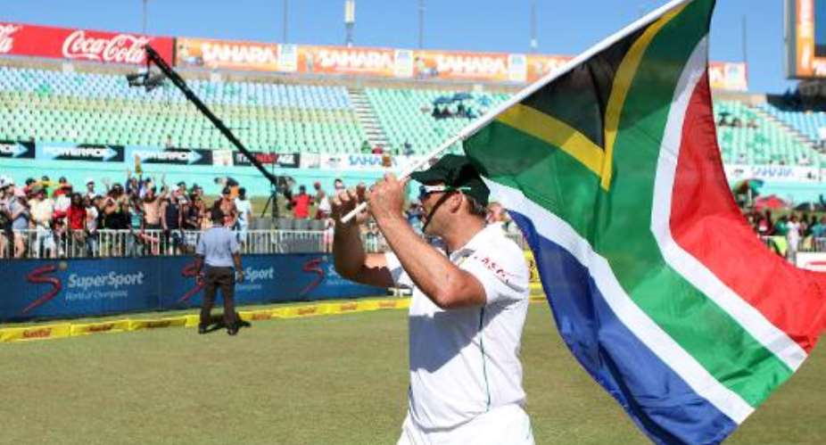 Jacques Kallis acknowledges the crowd in a lap of honour around the field    at the second Test between India and South Africa in Durban on December 30, 2013.  By Anesh Debiky AFP