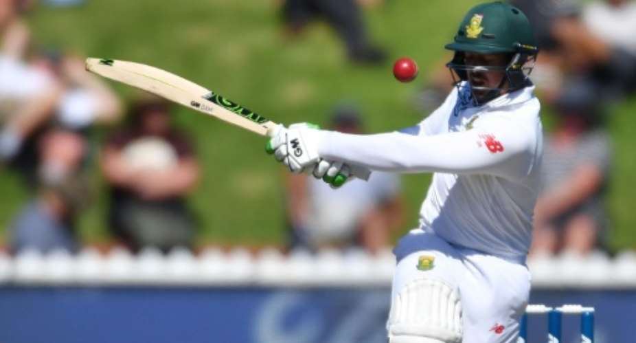 South Africa's keeper Quinton de Kock races to his eighth Test 50 in 55 balls in the second Test against New Zealand in Wellington.  By Marty MELVILLE AFP