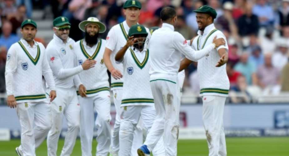 South Africa's Keshav Maharaj 2R celebrates taking the wicket of England's Liam Dawson for 13 on the second day of the second Test match between England and South Africa at Trent Bridge cricket ground in Nottingham, central England on July 15, 2017.  By Anthony Devlin AFP