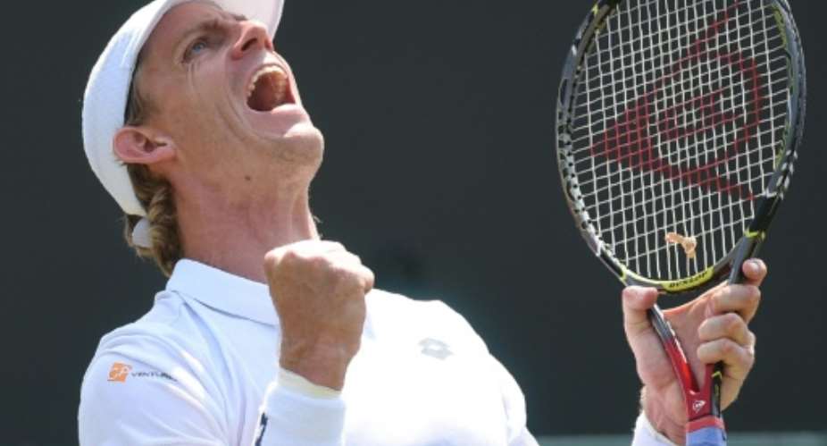 South Africa's Kevin Anderson celebrates after beating  Philipp Kohlschreiber.  By Oli SCARFF AFP