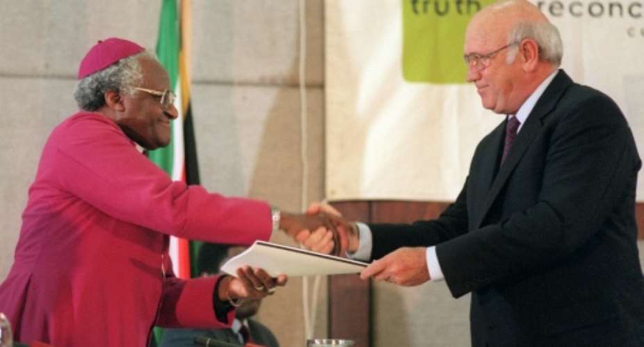South Africas last white president, FW de Klerk (right), made submissions to the commission led by Archbishop Desmond Tutu.  By Anna ZIEMINSKI (AFP/File)