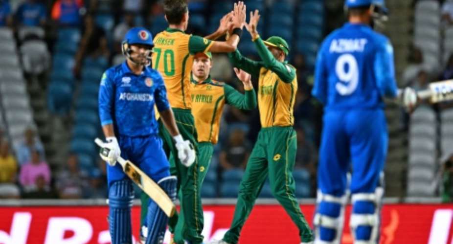 South Africas Marco Jansen (left) celebrates after having Afghanistans Nangeyalia Kharote out caught behind in their World Cup semi-final.  By Chandan Khanna (AFP)