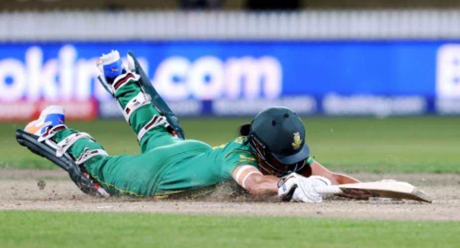 South Africas Marizanne Kapp dives for a run in the win over New Zealand.  By MICHAEL BRADLEY AFP