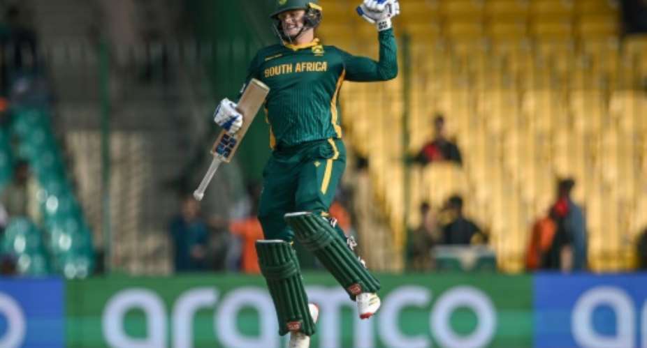 South Africas Ryan Rickelton celebrates after reaching his  hundred against Afghanistan in Karachi.  By Rizwan TABASSUM (AFP)