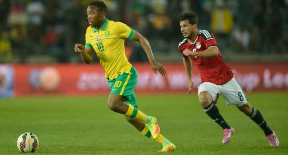 South Africa's Sibisiso Vilakazi L vies with Egypt's Terek Hamid at Orlando Stadium on September 6, 2016 in Johannesburg.  By Mujahid Safodien AFP
