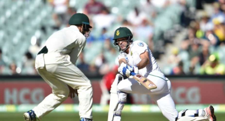 South Africa's Stephen Cook R hits a ball past Australia's captain Steve Smith on the third day of the third Test against Australia at the Adelaide Oval in Adelaide on November 26, 2016.  By Peter Parks AFP