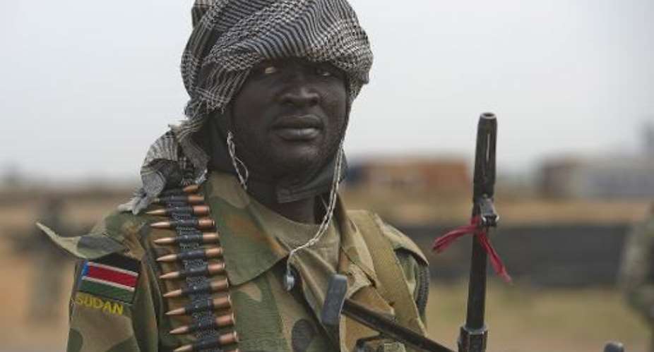 A South Sudan Peoples Liberation Army (SPLA) soldier is pictured during a patrol in Malakal on January 21, 2014 a few days after retaking the town from rebel fighters.  By Harrison Ngethi (AFP/File)