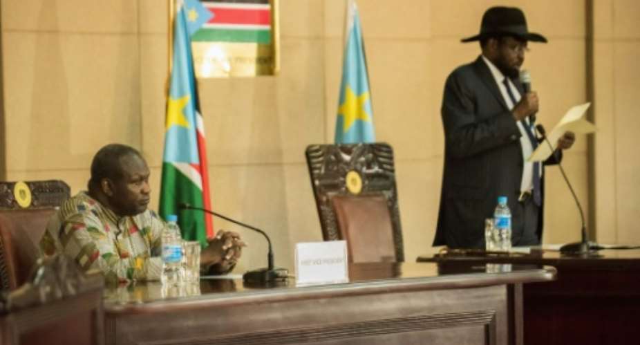 South Sudan President Salva Kiir right delivers a statement as former rebel leader and new vice-president Riek Machar listens during a ceremony at the Presidential House in Juba.  By Charles Lomodong AFPFile
