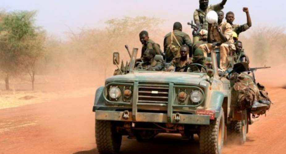 Sudanese soldiers ride in a military vehicle in the oil region of Heglig in April 2012.  By Ashraf Shazly AFPFile