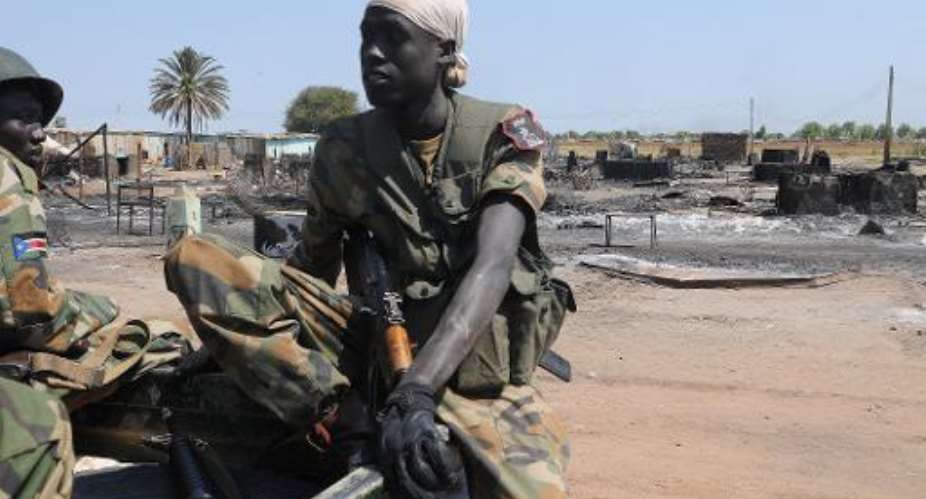 South Sudan's former rebel army the Sudan People's Liberation Army SPLA soldiers sit in a pick-up in the key north oil city of Bentiu after capturing it from rebels on January 12, 2014.  By Simon Maina AFPFile
