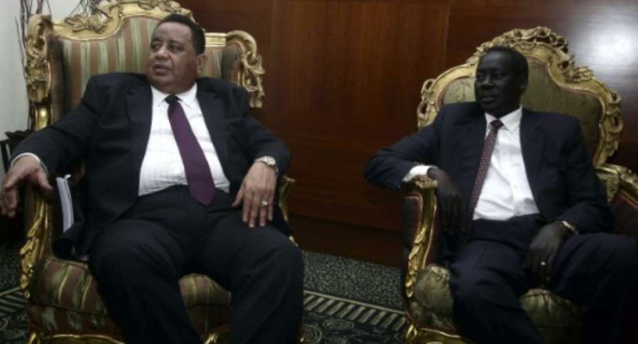 Sudanese Foreign Minister Ibrahim Ghandour L meets with his South Sudanese couterpart Deng Alor in Khartoum on June 5, 2016.  By Ebrahim Hamid AFP