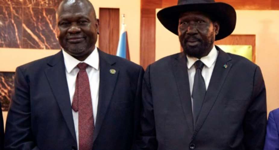South Sudanese President Salva Kiir right and his arch-rival Vice President Riek Machar have differing views on the elections.  By ALEX MCBRIDE AFPFile