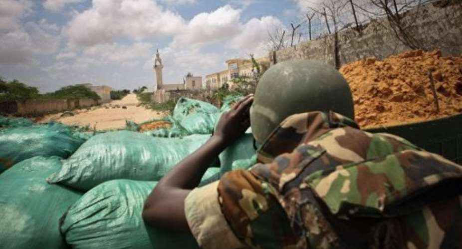 A Burundian soldier serving with the African Union Mission in Somalia looking along a road in Mogadishu in August.  By Stuart Price AFPAU-UN ISTFile