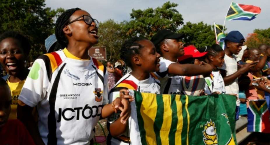 Soweto Rugby School Academy's girl players await the return of their Springbok heroes after winning the World Cup.  By Phill Magakoe AFP