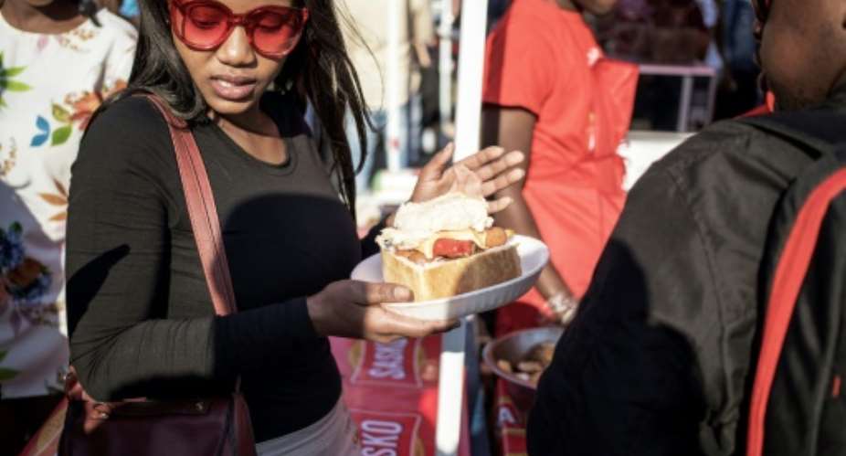 Soweto's iconic 'Kota' street sandwich inspired a festival in the township.  By GIANLUIGI GUERCIA AFP