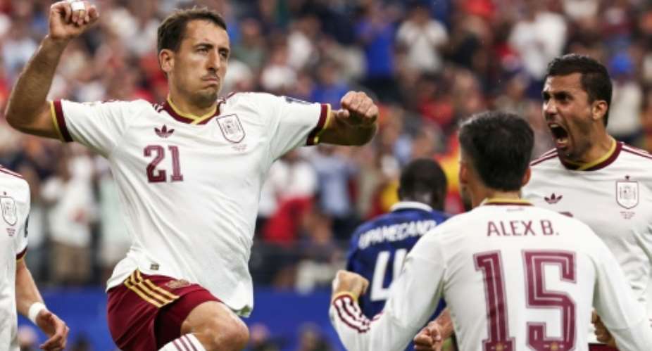 Spain forward Mikel Oyarzabal celebrates scoring against France in their World Cup semi-final in Arlington, Texas.  By FRANCK FIFE (AFP)