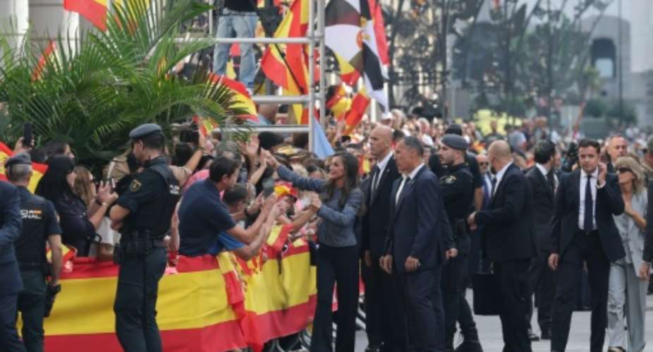 Spains Queen Letizia shakes hands  with people lining the streets of Ceuta.  By Thomas COEX (AFP)