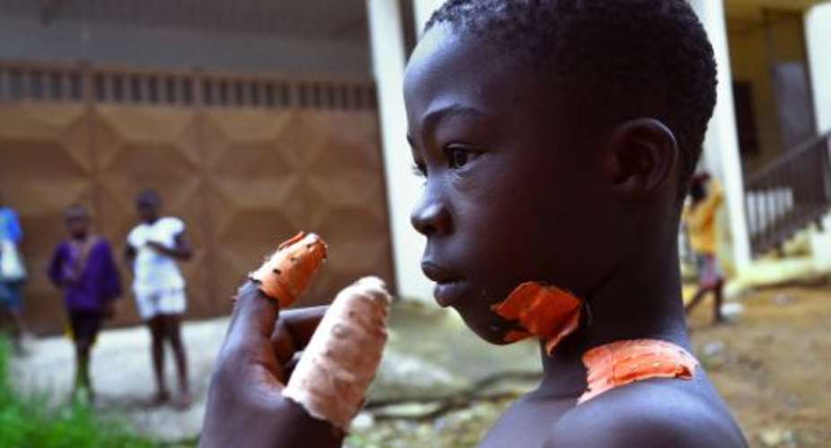Ten-year-old Souleymane, who survived an attack, recounts the assault in Yopougon, Ivory Coast, on January 26, 2015.  By Herve Sevi AFP