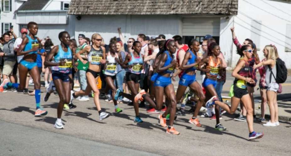 Spectators cheer the elite women as they make their way past the 6 mile mark of the Boston Marathon on April 17, 2017 in Framingham, Massachusetts.  By Kayana Szymczak GETTYAFP