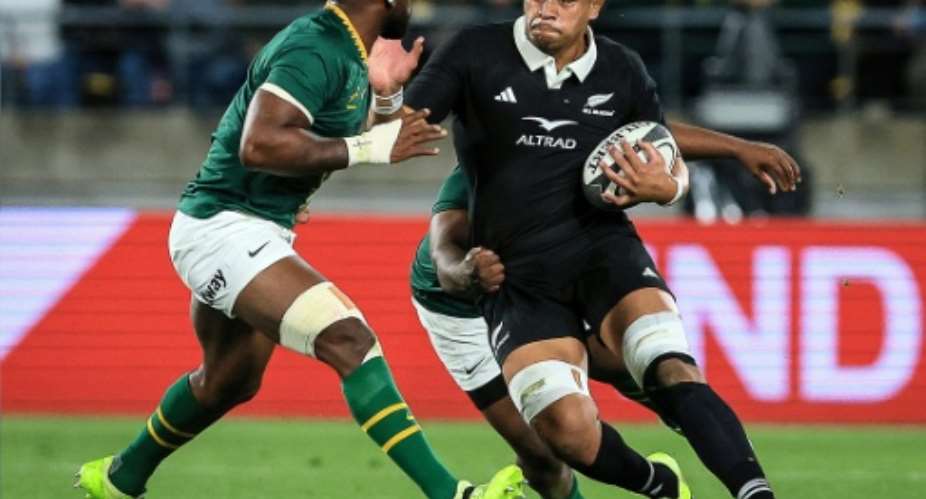 Springbok Siya Kolisi (L) prepares to tackle All Black Tupou Vaai during a 2025 Rugby Championship match in Wellington..  By Grant Down (AFP)