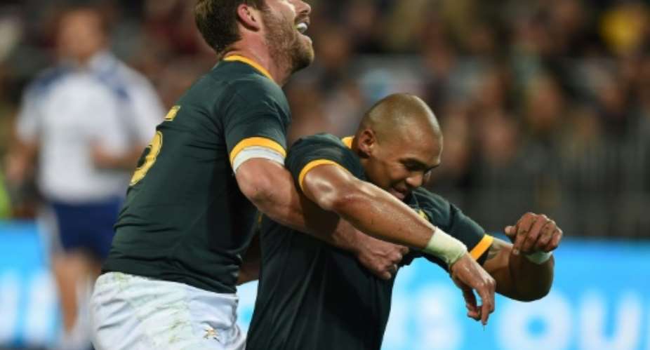 Springbok winger Cornal Hendricks R celebrates scoring a try against New Zealand in a 2014 Rugby Championship match in Wellington.  By Marty Melville AFPFile