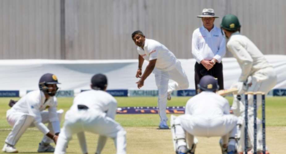 Sri Lanka captain Rangana Herath bowls during the third day's play in the first Test match against hosts Zimbabwe at the Harare Sports Club on October 31, 2016.  By Jekesai Njikizana AFP