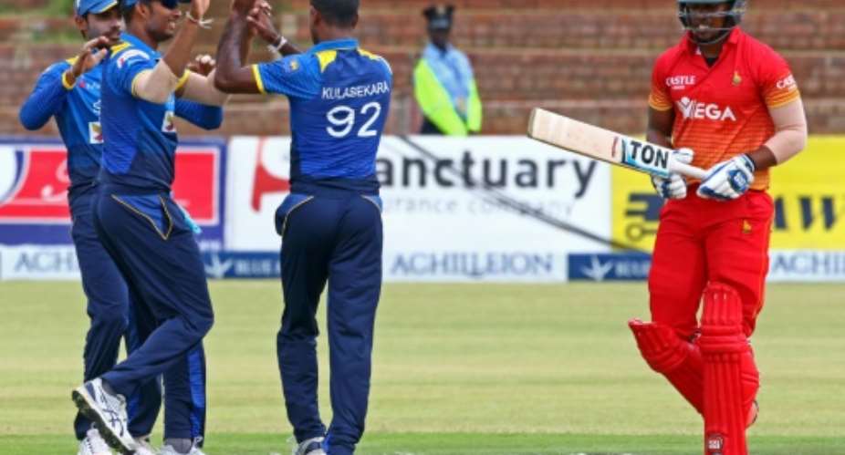 Sri Lanka celebrate a wicket during the abandoned one-day international against Zimbabwe in Bulawayo on November 21, 2016.  By Jekesai Njikizana AFP