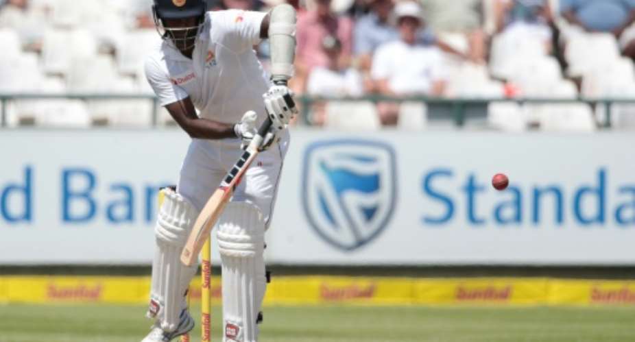 Sri Lanka's batsman and captain Angelo Mathews plays a shot during their second Test match against South Africa at Newlands Cricket Stadium in Cape Town, on January 5, 2017.  By GIANLUIGI GUERCIA AFPFile