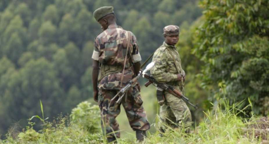DRCongo soldiers patrol in May 2004, where an attack allegedy perpetrated by FDLR militamen took place.  By  AFPFile