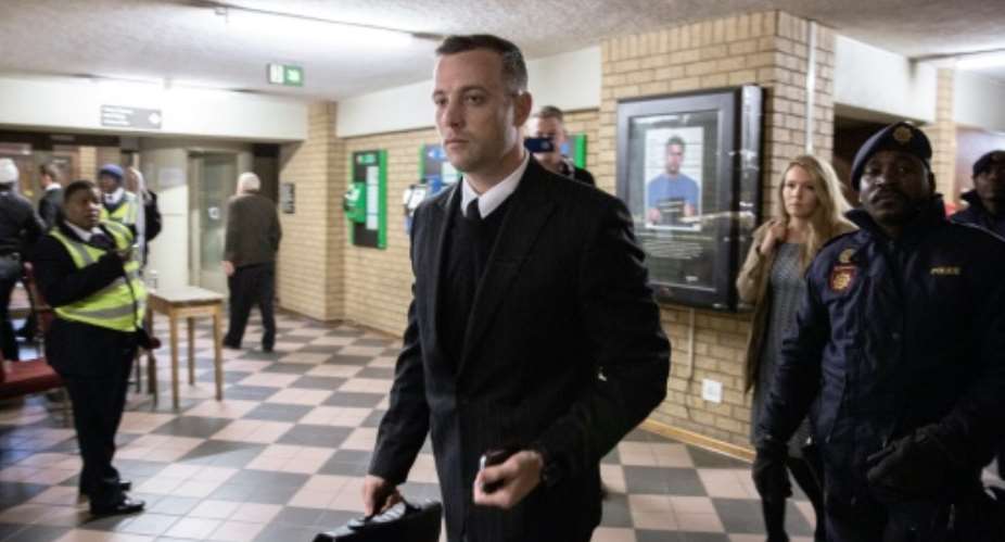 South African Paralympian Oscar Pistorius arrives at the Pretoria High Court on June 14, 2016 on the second day of his sentencing hearing.  By Gianluigi Guercia AFP