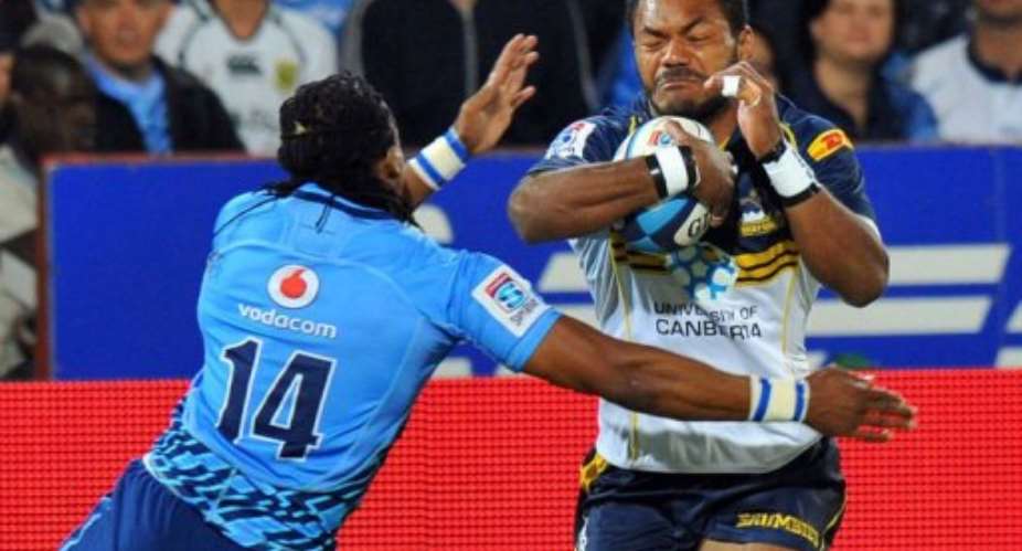 Australias ACT Brumbies winger Henry Speight (R) clashes with a South-Africas Northern Bulls player.  By Alexander Joe (AFP)