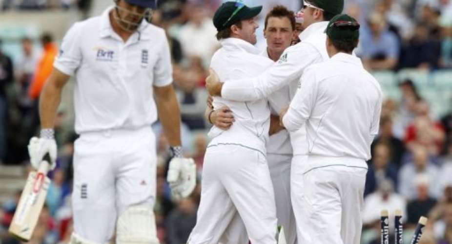 South Africa's Dale Steyn 3rd left celebrates bowling England's Alastair Cook left for 115.  By Ian Kington AFP