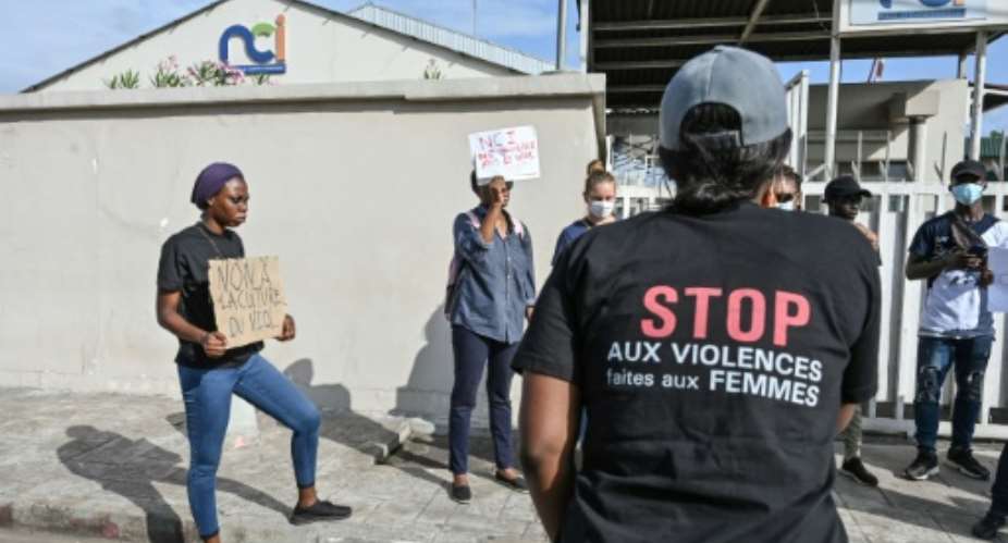 'Stop violence against women': A rights group says Ivorian women suffer an average of five sexual assaults and two rapes each day.  By Sia KAMBOU AFP