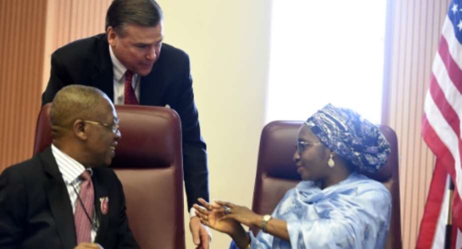 Stuart Symington, who has been appointed as the US special envoy on South Sudan, stands behind two Nigerian ministers in 2017 when he was ambassador to Abuja.  By PIUS UTOMI EKPEI AFPFile