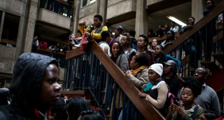 Students at the Wits Universityb in Johannesburg protest against fees increases which they say are hitting people from black communities hardest.  By John Wessels AFP