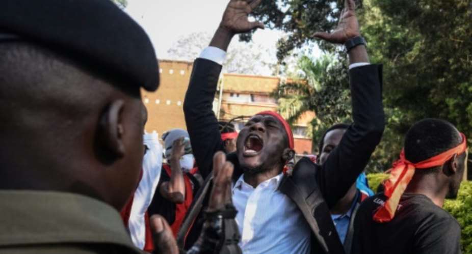 Students at Uganda's Makerere University defied a blanket ban on protests on the same day as a brawl in parliament.  By Isaac Kasamani AFP