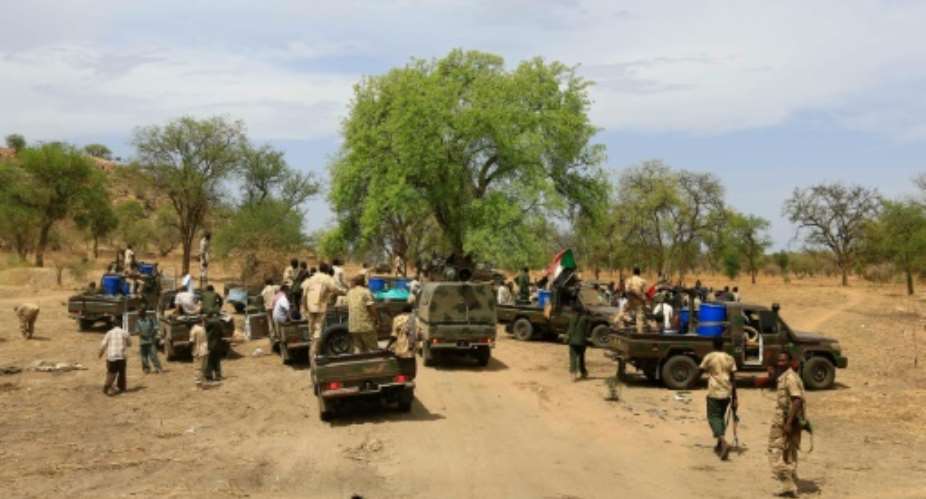 Sudanese soldiers gather in the Daldako area, about 20 kilometres northeast of South Kordofans state capital Kadugli, after recapturing the area from rebels on May 20, 2014.  By  (AFP/File)