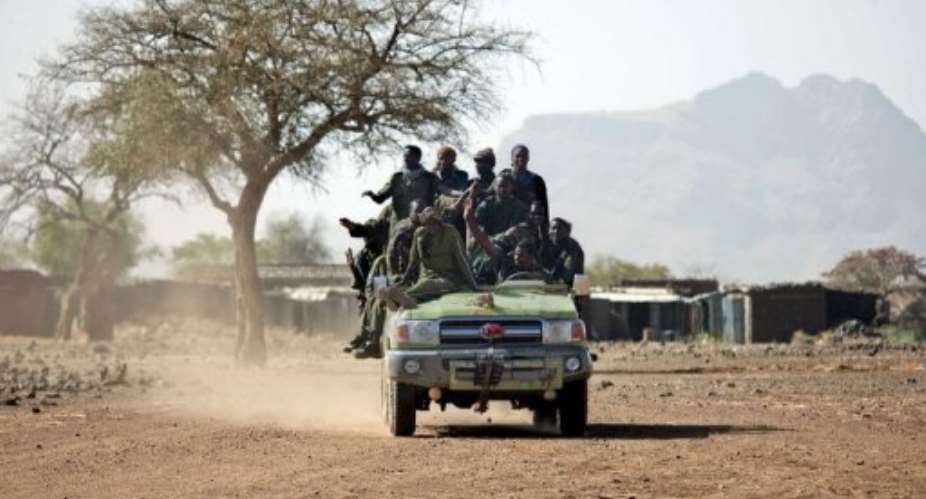 Members of the Sudanese Army atop of a four-wheel drive in Jawa village in 2011.  By Albert Gonzalez Farran AFPUNAMIDFile