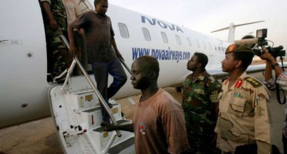 Foreigners captured whilst investigating debris from recent fighting between Sudan and South Sudan in the Heglig area.  By Ashraf Shazly (AFP)