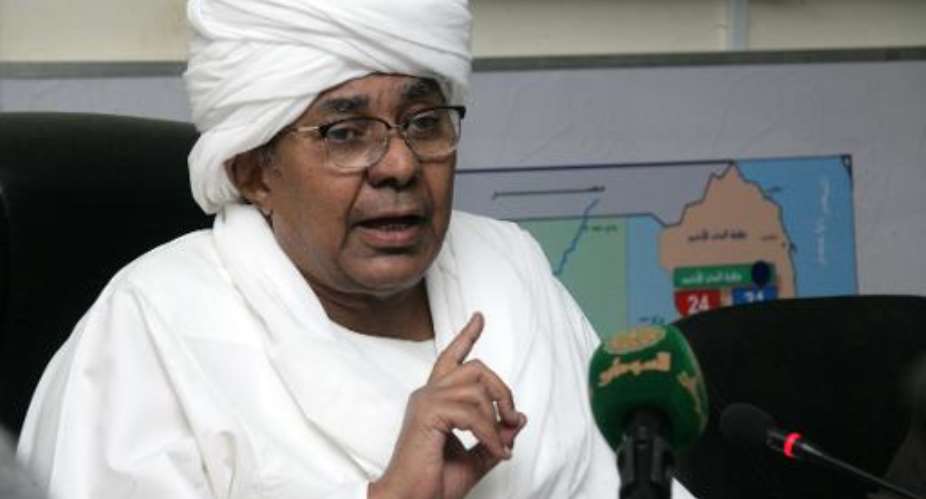 Mukhtar al-Assam, chief of Sudan's National Election Commission, speaks during a press conference in the capital Khartoum, to announce that national elections will be postponed, on December 23, 2014.  By Ebrahim Hamid AFP