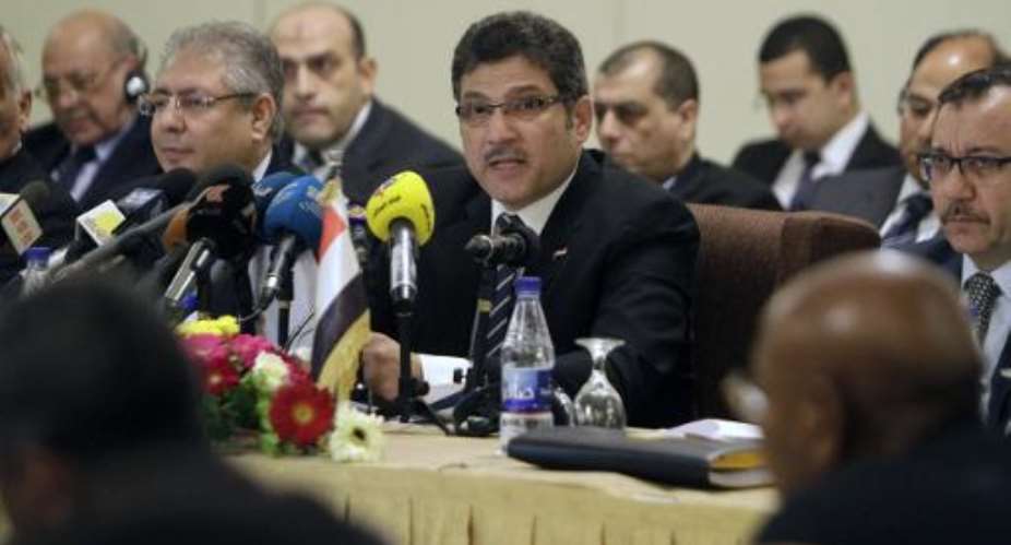 Egyptian Minister of Irrigation, Hossam Maghazi C, speaks during a Nile River forum with his Sudanese and Ethiopian counterparts in the Sudanese capital Khartoum on August 25, 2014.  By Ashraf Shazly AFP