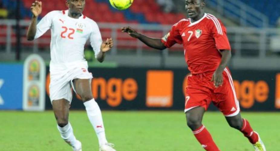 Sudan's Agab Ramadan R vies for the ball with Burkina Faso's Saidou Mady L.  By Abdelhak Senna AFP