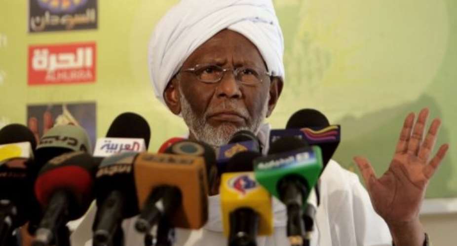 Sudan's Islamist opposition leader Hassan al-Turabi speaks to media in Khartoum in January.  By Ashraf Shazly AFP
