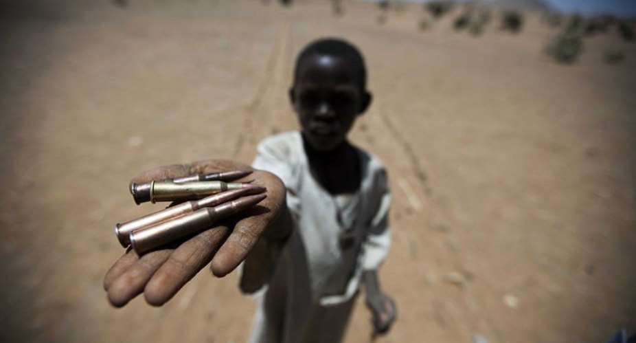 A child displaying bullets he collected from the ground in Rounyn, North Darfur, in March.  By Albert Gonzalez Farran AFPUNAMIDFile