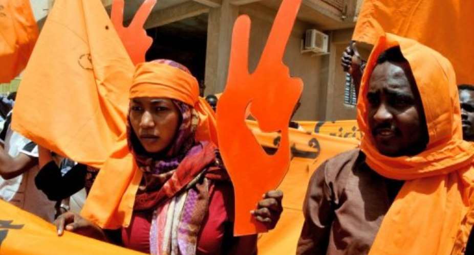 Members of opposition group Girifna (Were Fed Up) protest in Khartoum in April.  By Ebrahim Hamid (AFP/File)