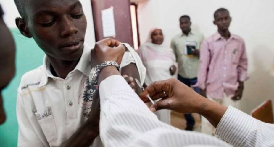 A staff member of the Teaching Hospital in El-Geneina in West Darfur is vaccinated against yellow fever in November 2012.  By Albert Gonzalez Farran UNAMIDAFPFile